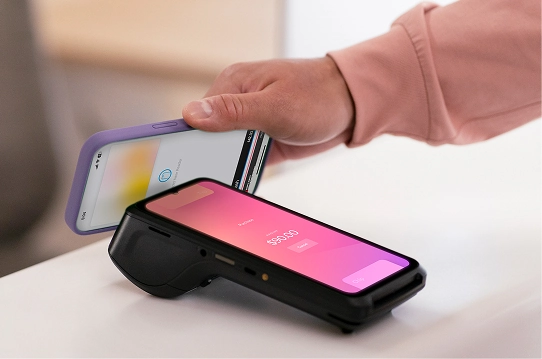 Phone presented to a payment terminal at a counter